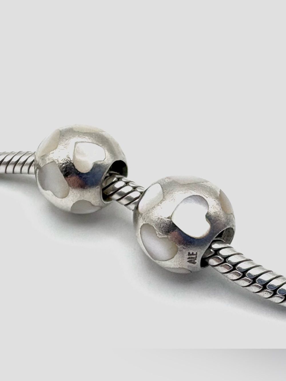 Two Pandora Love Me Mother of Pearl Charms White Hearts